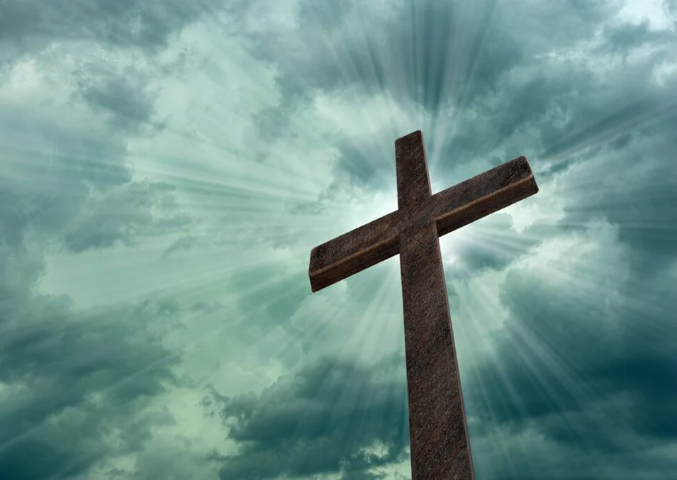 religious-cross-against-light-rays-and-parting-clouds-1024x684 copy